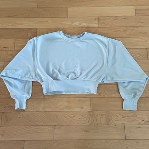 Light blue TNA cropped sweatshirt.
